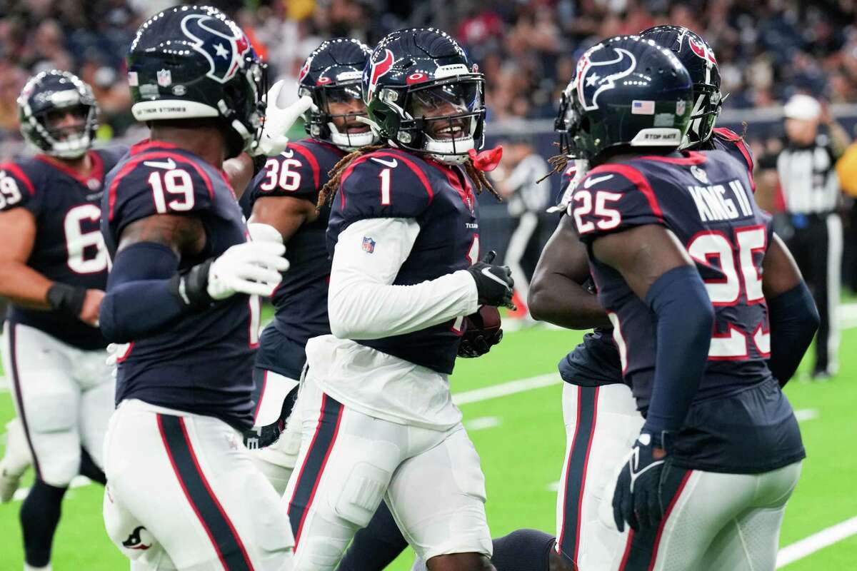 Houston Texans cornerback Tremon Smith (1) celebrates his interception of a pass by New Orleans Saints quarterback Ian Book during the first half of an NFL football game Saturday, Aug. 13, 2022, in Houston.