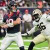 Houston Texans quarterback Davis Mills (10) drops back to pass as he is pressured by New Orleans Saints defensive end Carl Granderson (96) during the first half of an NFL football game Saturday, Aug. 13, 2022, in Houston.