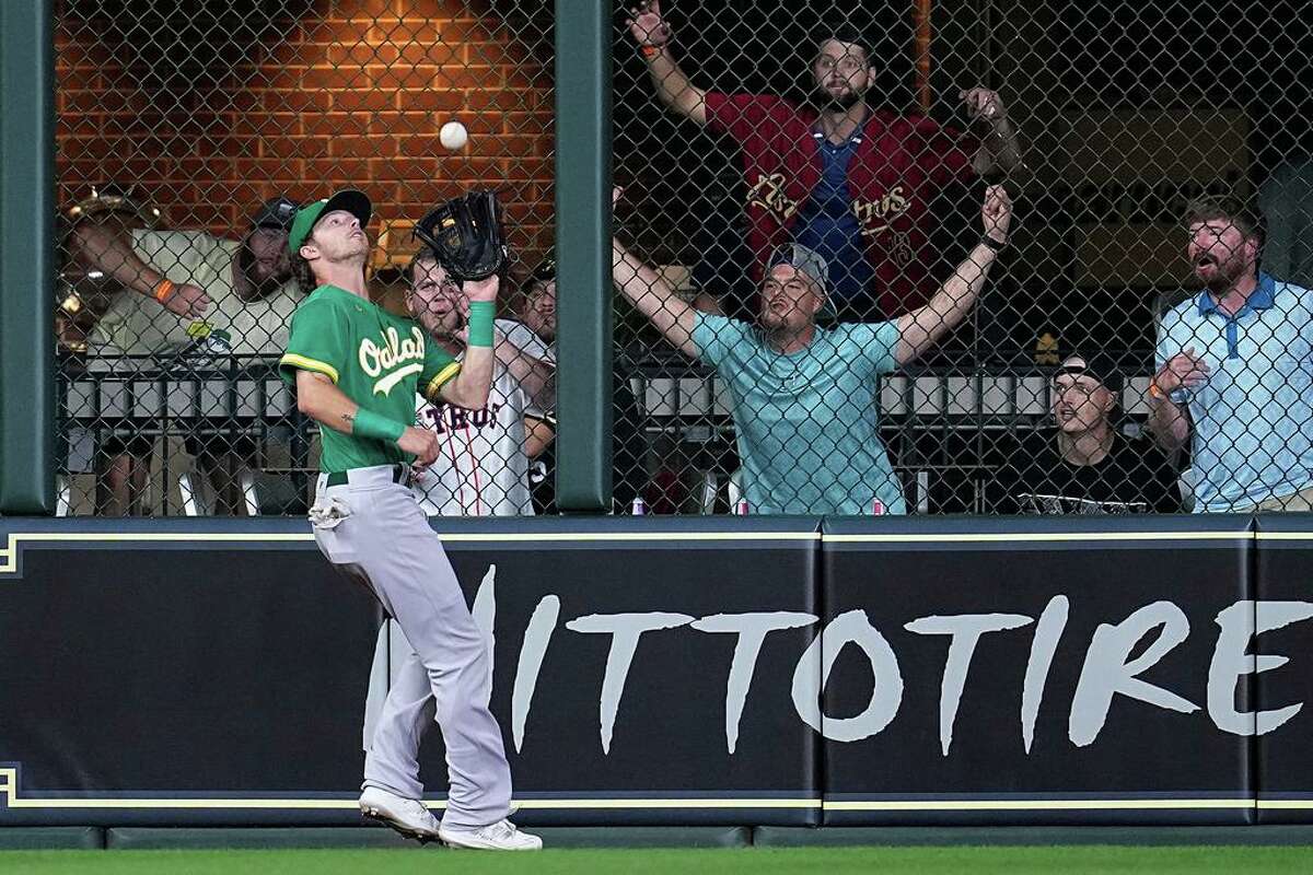 Oakland Athletics center fielder Skye Bolt catches a fly ball from Houston Astros' Kyle Tucker during the seventh inning of a baseball game Friday, Aug. 12, 2022, in Houston. (AP Photo/Kevin M. Cox)