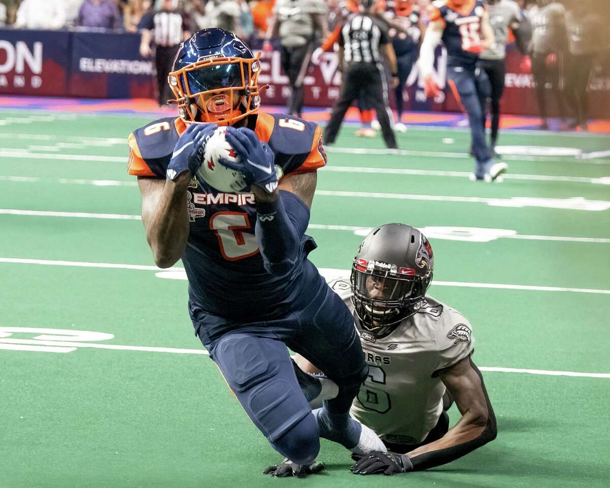 Albany Empire receiver Darius Price makes a diving catch in front of Carolina Cobras defender Herbert Waters during the National Arena League championship game at MVP Arena in Albany, N.Y., on Saturday, Aug. 13, 2022. (Jim Franco/Special to the Times Union)