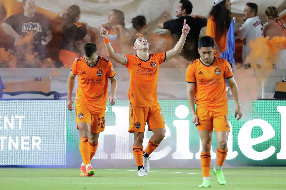 Houston Dynamo forward Sebastian Ferreira, middle, celebrates his goal against CF Montreal between Ethan Bartlow (13) and Memo Rodríguez, right, during the first half of an MLS soccer match Saturday, Aug. 13, 2022, in Houston. (AP Photo/Michael Wyke)