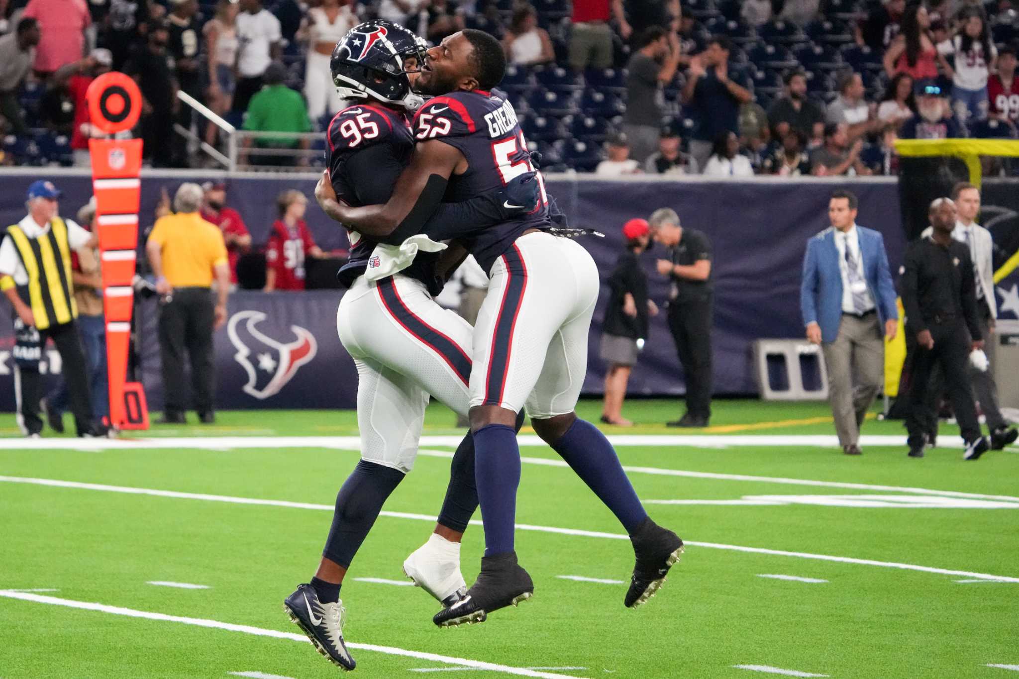 Houston Texans defensive end Jonathan Greenard (52) celebrates a fourth  down stop during the first half of an NFL football game Sunday, Sept. 11,  2022, in Houston. (AP Photo/Eric Christian Smith Stock