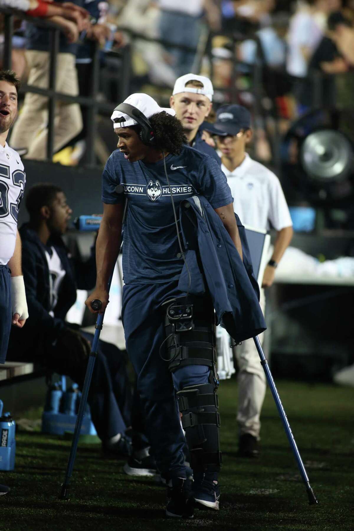 NASHVILLE, TN - OCTOBER 02: Connecticut Huskies quarterback Tyler Phommachanh (12) walks the sideline on crutches after suffering a knee injury during a game between the Vanderbilt Commodores and Connecticut Huskies, October 2, 2021, at Vanderbilt Stadium in Nashville, Tennessee. (Photo by Matthew Maxey/Icon Sportswire via Getty Images)