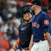 Houston Astros' catcher Christian Vazquez (9) talks with relief pitcher Ryan Pressly (55) after the ninth inning of an MLB game Sunday, Aug. 14, 2022, at Minute Maid Park in Houston.