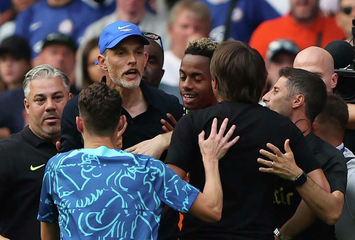 Chelsea’s Thomas Tuchel (in hat) and Tottenham’s Antonio Conte clash after the game, earning both managers red cards.