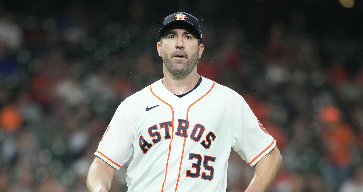 Houston Astros starting pitcher Justin Verlander (35) reacts as he walked back to the dugout after Texas Rangers Meibrys Viloria's fly out to end the top of the sixth inning of an MLB game at Minute Maid Park on Wednesday, Aug. 10, 2022 in Houston.