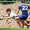 Trumbull's Corbin Smith of the USA U18 rugby team dives forward with the ball during a match against Belgium on the Corendon Tour in Amsterdam on July 16, 2022.