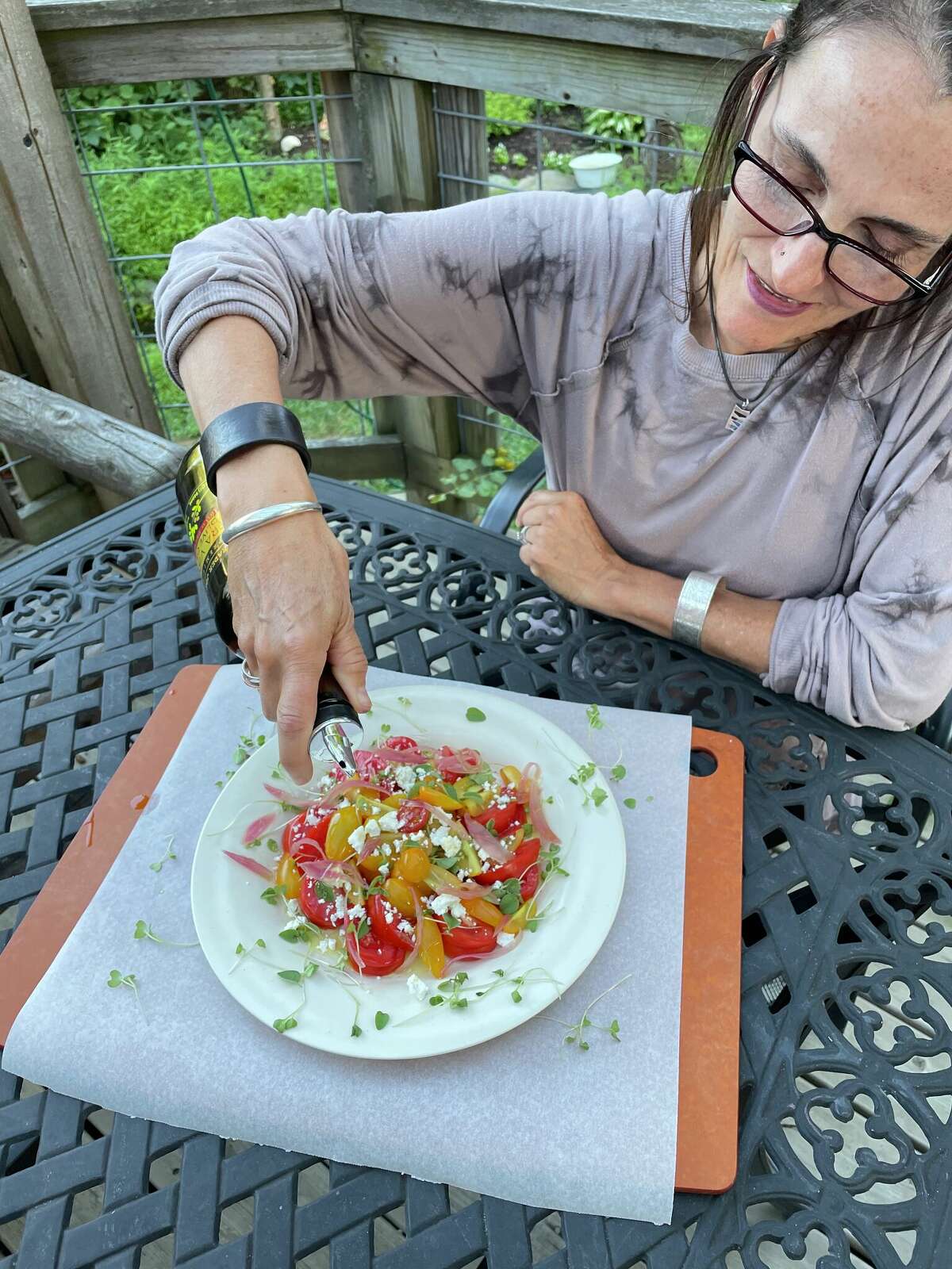 Pickled onions and fresh oregano -- rather than basil -- accent Caroline Barrett's tomato salad.