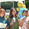 Susi Trejo, left, and her daughters Amy, 12, and Ayleen, 10, enjoy snow cones during Family Centers Health Care clinic’s annual Community Health Fair at Wilbur Peck Court in Greenwich on Saturday. Families were able to get free information about a variety of health services available, food, giveaways, activities for the kids and more.