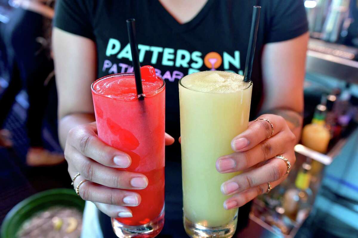 Patterson Park, the treehouse bar set on White Oak Bayou Trail, blends up two frozen cocktails: Frozen Pickleback (Tullamore Dew, pickle juice and lime), right, and Bark Park Punch (vanilla rum and cherry).