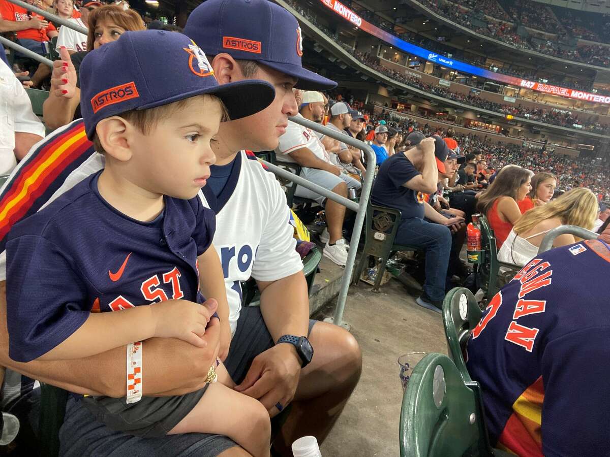 Two-year-old Jackson Silvas and his dad Steven at an Astros game at Minute Maid Park in 2022.