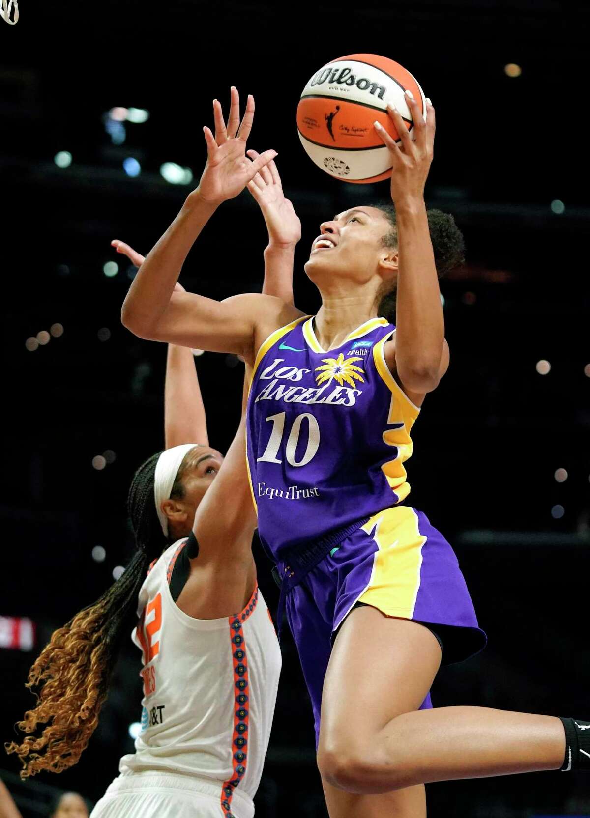 Los Angeles Sparks forward Olivia Nelson-Ododa, right, shoots as Connecticut Sun center Brionna Jones defends on Aug. 11. Nelson-Ododa credits UConn for helping her adjust to the pros: “I think that was a key piece in my player development, going through college and just kind of experiencing that really hard-nosed, great program. And I think it’s been able to help me in my transition to WNBA.”