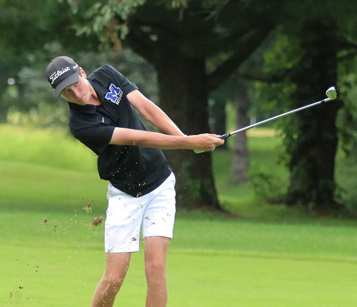 Marquette Catholic's Aidan O'Keefe hits his second shot to the green on hole No. 14 on Monday at EA-WR's Hickory Stick Invite at Belk Park in Wood River. O'Keefe won the 20-team tourney at even-par 72.
