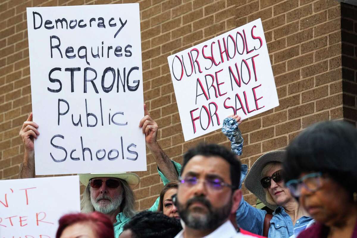 People speak out against a proposed policy change on charter schools at HISD during a news conference Monday, Aug. 15, 2022 in Houston. The change would alter how the district partners with charter schools.