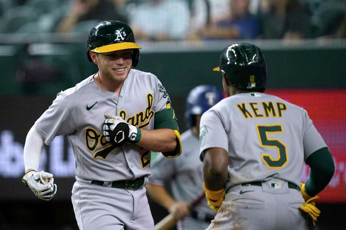 Oakland Athletics' Cal Stevenson runs to first base after earning