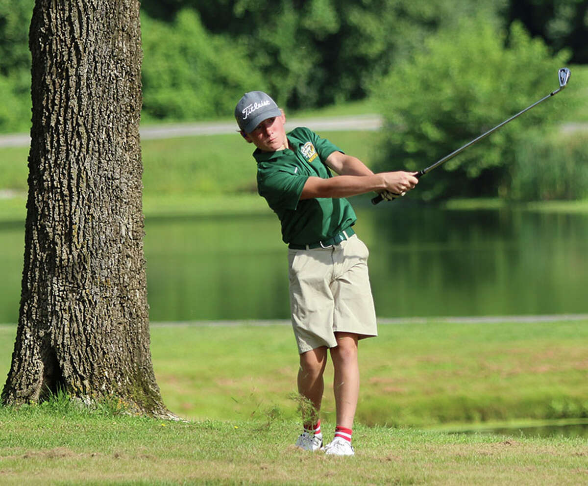 Metro-East Lutheran's Jacob Kober watches his shot on No. 13 during the Hickory Stick Invitational on Monday at Belk Park Golf Course in Wood River.
