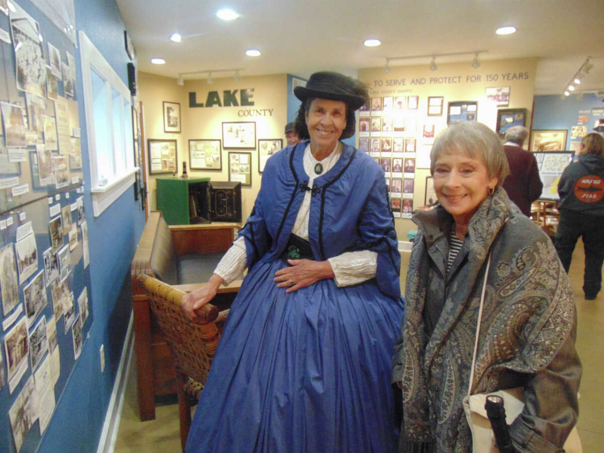 A full day of rain didn't stop the celebration of Baldwin's Sesquicentennial. The originally planned street fair move inside the Lake County Historical Museum and downtown businesses.Historical reenactor Marty Corbin (left) shows visitor Janet Dombrouski, around. 