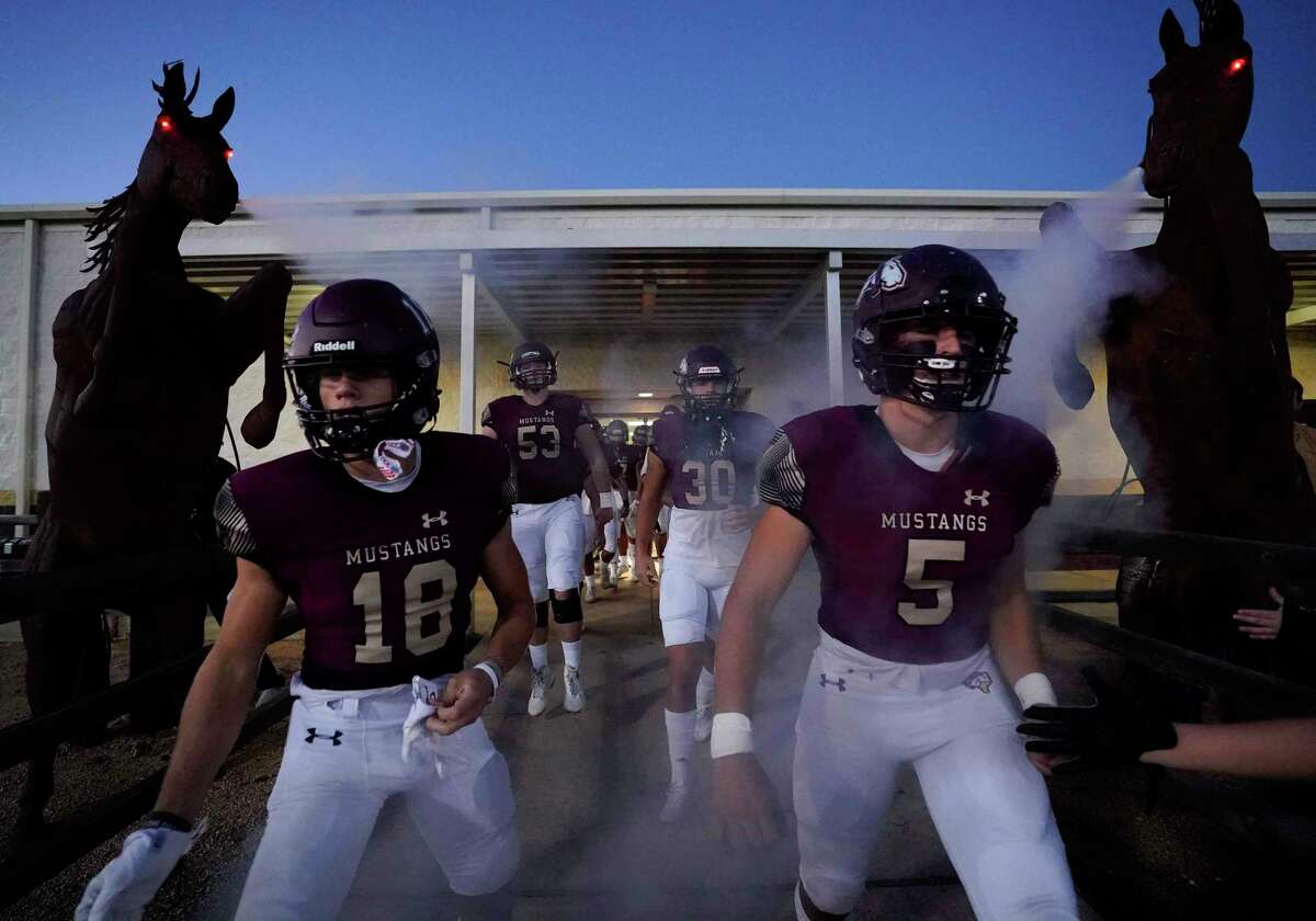 Magnolia West’s Colton Adcox (18) and Caylon Dygert (5) leave the locker room to play College Station in a high school football game, Friday, Nov. 5, 2021, in Magnolia.