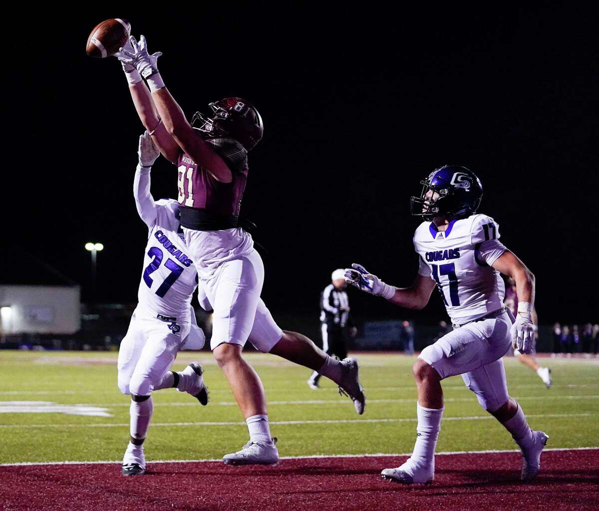 Magnolia West tight end Wade Nobles (81) misses a catch for a 2-point conversion as College Station linebacker Kolton Griswold (27) and defensive back Kyle Walsh defend during the first half of a high school football game, Friday, Nov. 5, 2021, in Magnolia.