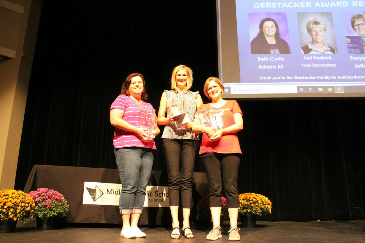From left, Midland Public Schools teachers Beth Curtis from Adams Elementary School, Jacqueline McGee from Woodcrest Elementary School and Tonya Lambert from Jefferson Middle School receive Gerstacker Awards for Excellence in Teaching on Tuesday, Aug. 16, 2022 at Central Auditorium. Not pictured is teacher and Gerstacker recipient Lori Hedrick of the Post-Secondary Program.