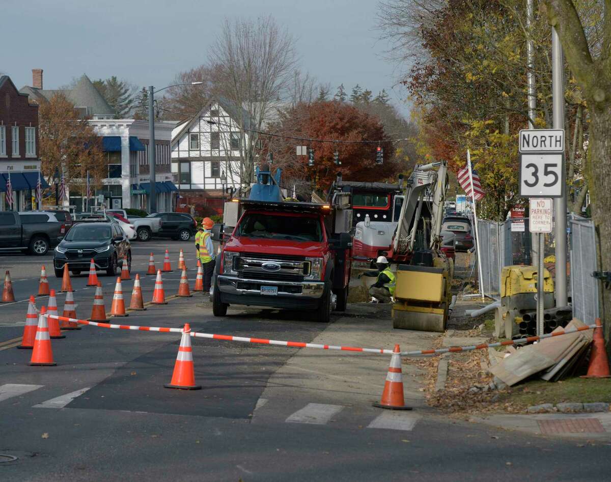 In this file photo, utility crews complete work on Main Street, between Governor and Prospect, in anticipation of a major realignment project. Wednesday, November 17, 2021, Ridgefield, Conn.
