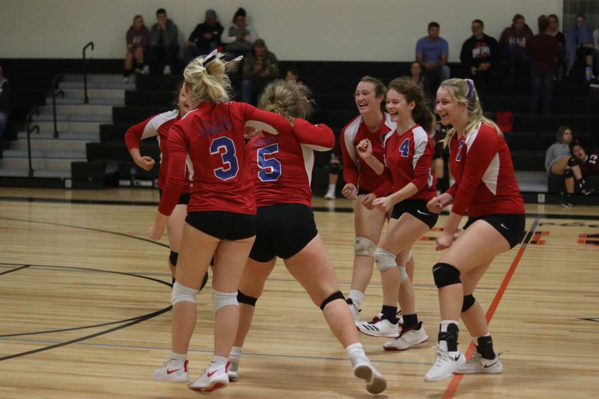 MCC's volleyball team celebrates a point during a match in 2021.