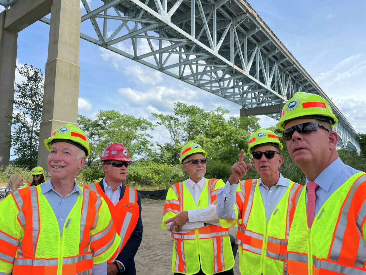 U.S. Labor Secretary Marty Walsh, right, observes work being done on the northbound side of the Gold Star Bridge in New London on Tuesday, with Gov. Ned Lamont, second from right, state DOT Commissioner Joe Giulietti, center, Keith R. Brothers of the Connecticut Laborers’ District Council, second from left, and U.S. Rep. Joe Courtney, D-2nd District, left, during a visit to  southeastern Connecticut to tour federally funded job training programs and infrastructure projects.