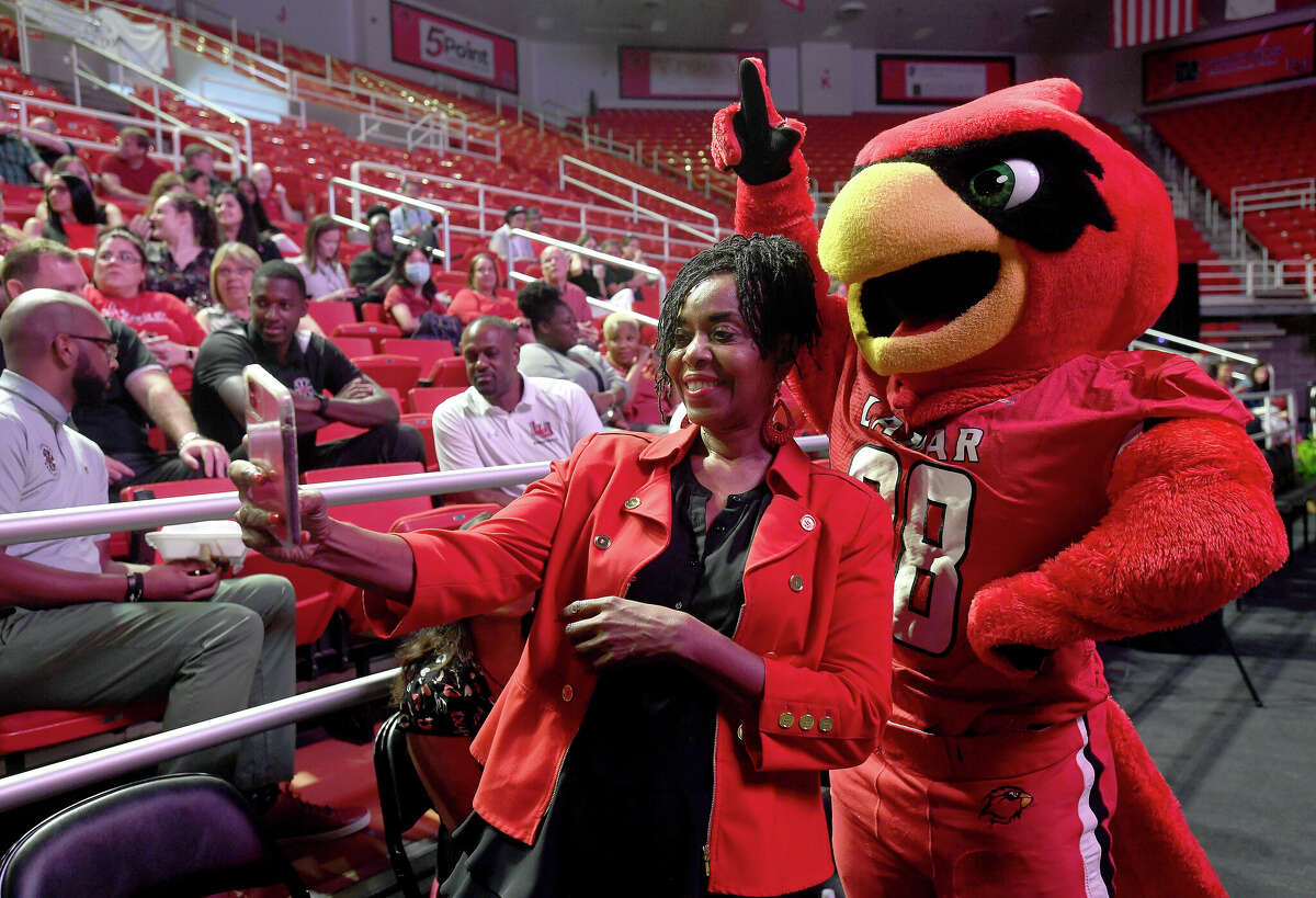 Education professor Katherine Sprott gets a photo with Big Red during Lamar University's 2022 convocation for faculty and staff as the college gets ready for the start of the fall semester. Photo made Tuesday, August 16, 2022. Kim Brent/The Enterprise