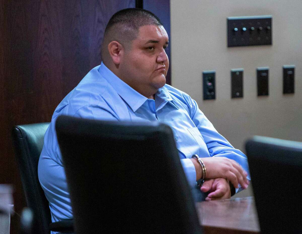 Rafael Castillo sits alone in handcuffs Tuesday in the 290th District Court after being found guilty of murder in the ax killing and dismemberment of Nicole Perry, 31.