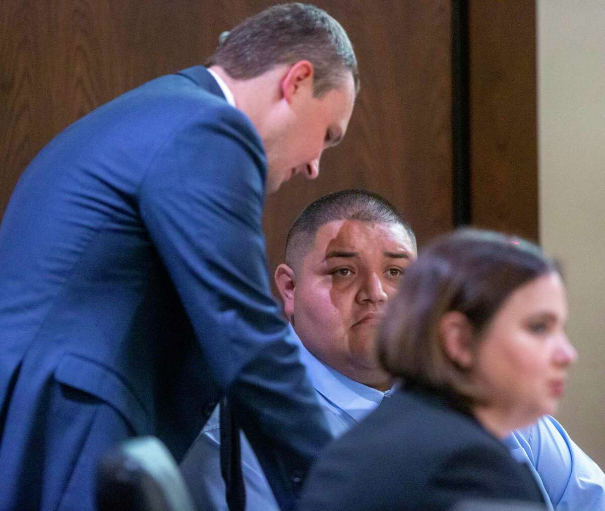 Rafael Castillo, center, talks Tuesday with his defense attorney Matt Allen in the 290th District Court. Castillo was on trial for murder, accused of dismembering and killing Nicole Perry, 31, on Nov. 19, 2020.