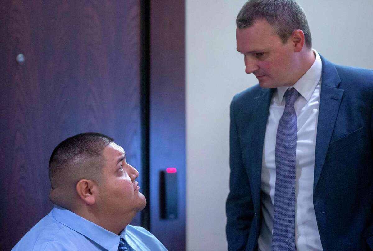 Rafael Castillo, left, talks Tuesday with his defense attorney Matt Allen in the 290th District Court. Castillo later was convicted of murder for dismembering and killing Nicole Perry, 31, on Nov. 19, 2020.
