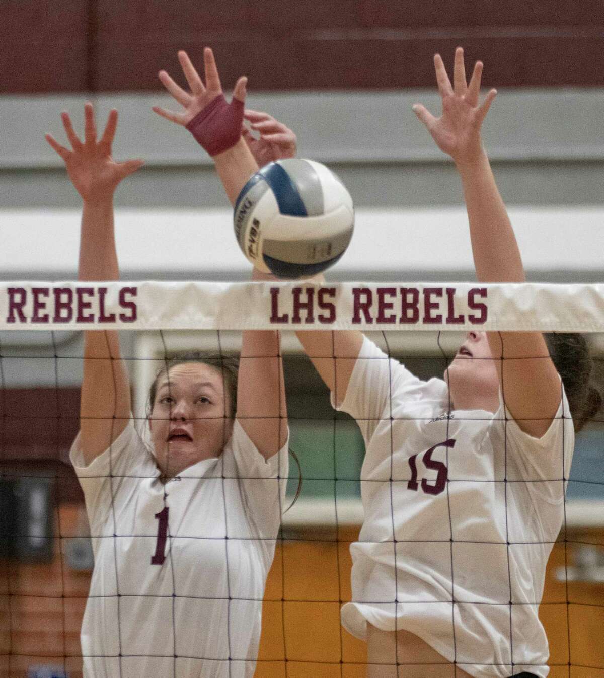 Legacy High's Kylee Radwanski and Sarah Philley go up for a block 08/16/2022 against Abilene Wylie at the Rebel Gym. Tim Fischer/Reporter-Telegram