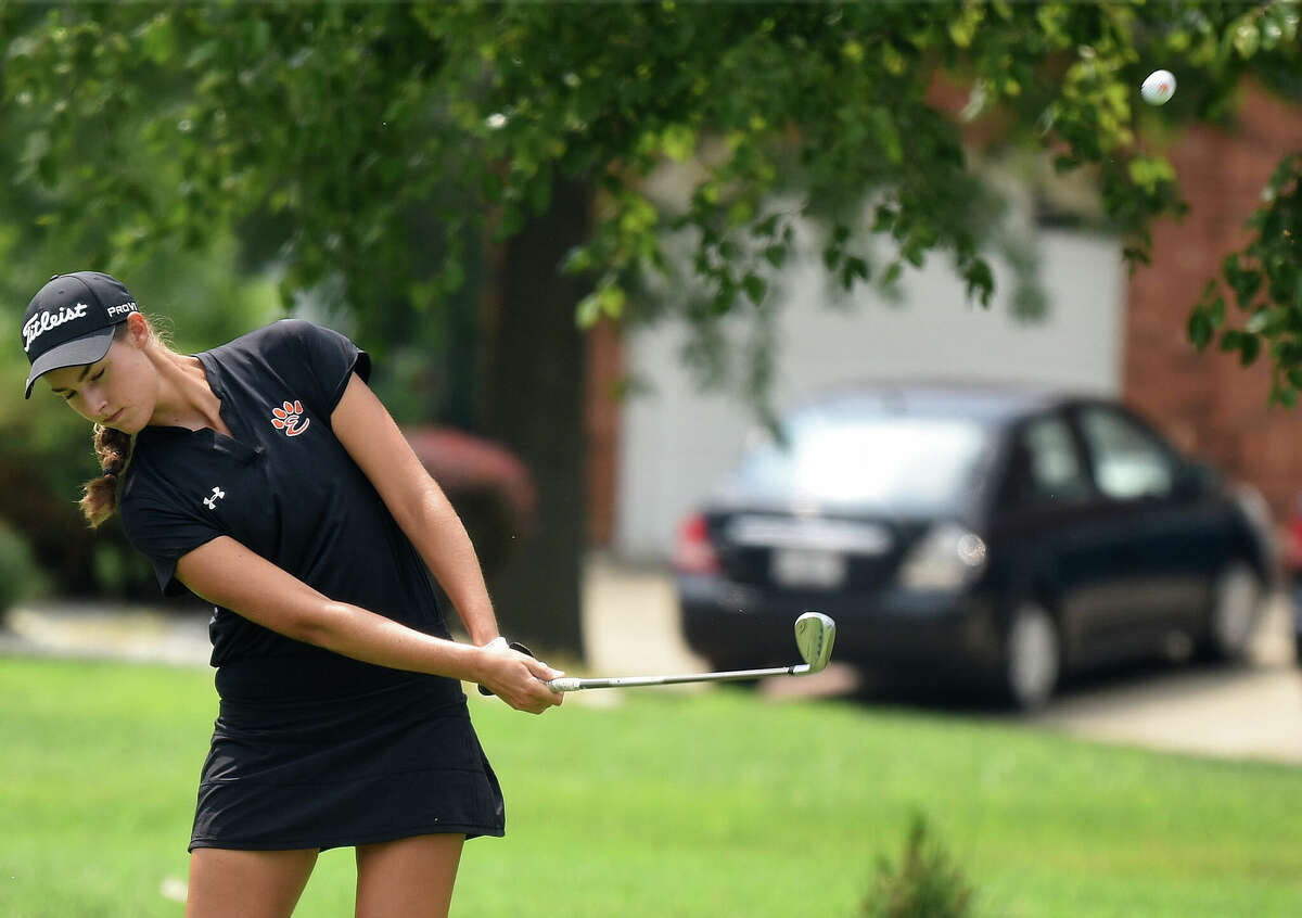 Edwardsville's Nicole Johnson hits an iron shot during the Madison County Tournament at Legacy Golf Course in Granite City.