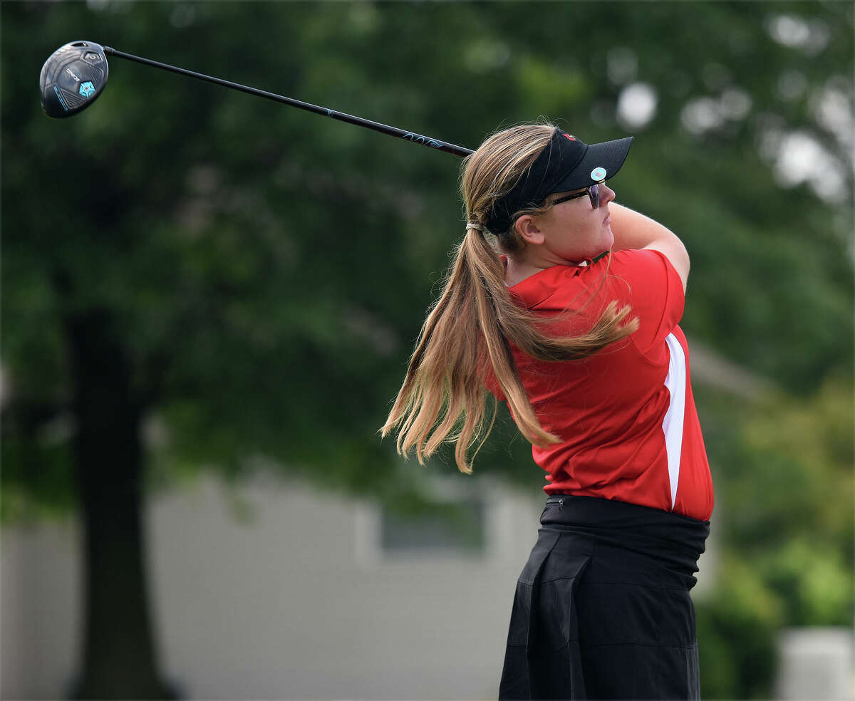 Alton's Addison Kenney watches her drive during the Madison County Tournament on Tuesday at Legacy Golf Course in Granite City.