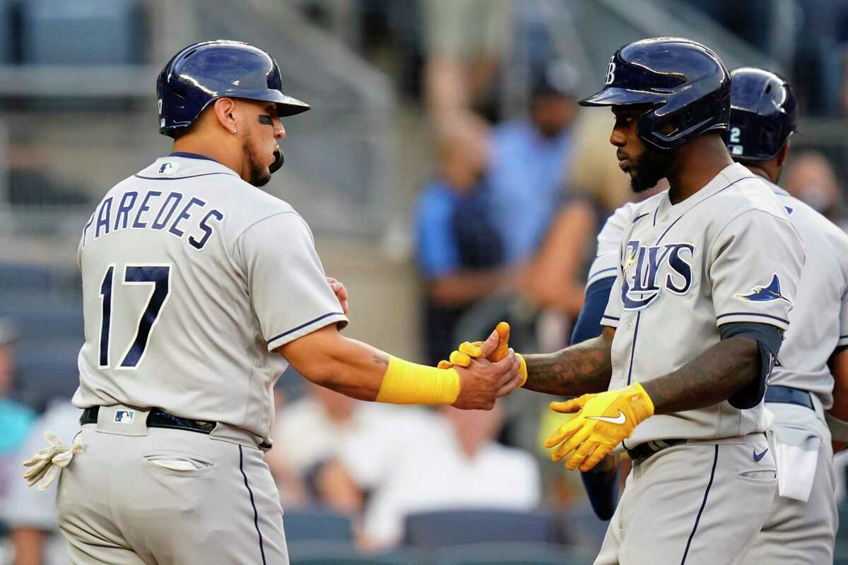 Tampa Bay Rays' Randy Arozarena, right, celebrates with Isaac Paredes after hitting a three-run home run during the first inning of a baseball game against the New York Yankees, Tuesday, Aug. 16, 2022, in New York. The Rays won 3-1. (AP Photo/Frank Franklin II)