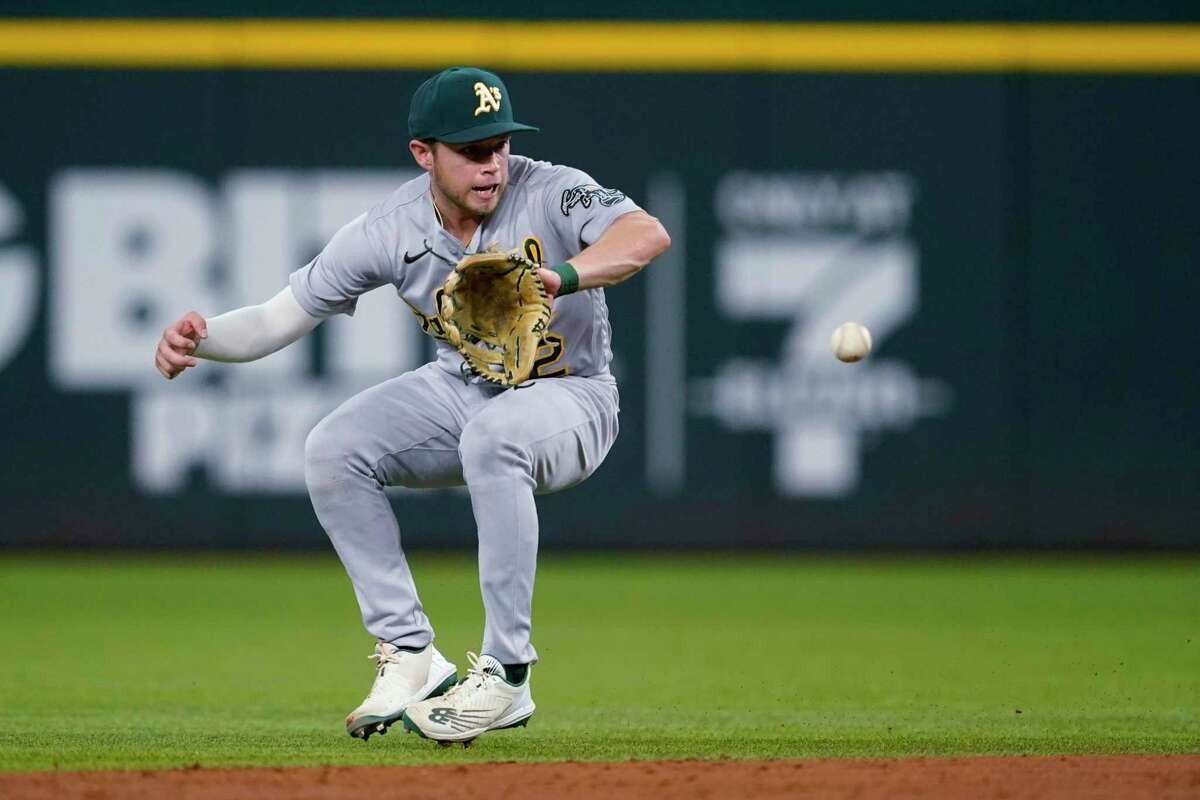 Oakland Athletics second baseman Nick Allen fields a grounder by Texas Rangers' Jonah Heim, who was out at first during the second inning of a baseball game in Arlington, Texas, Tuesday, Aug. 16, 2022. (AP Photo/Tony Gutierrez)