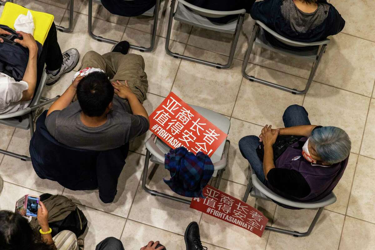 People are seen at Victory Hall during a town hall in wake of recent violence toward Asian American elderlies in the Chinatown neighborhood of San Francisco, Calif. Tuesday, Aug. 16, 2022.