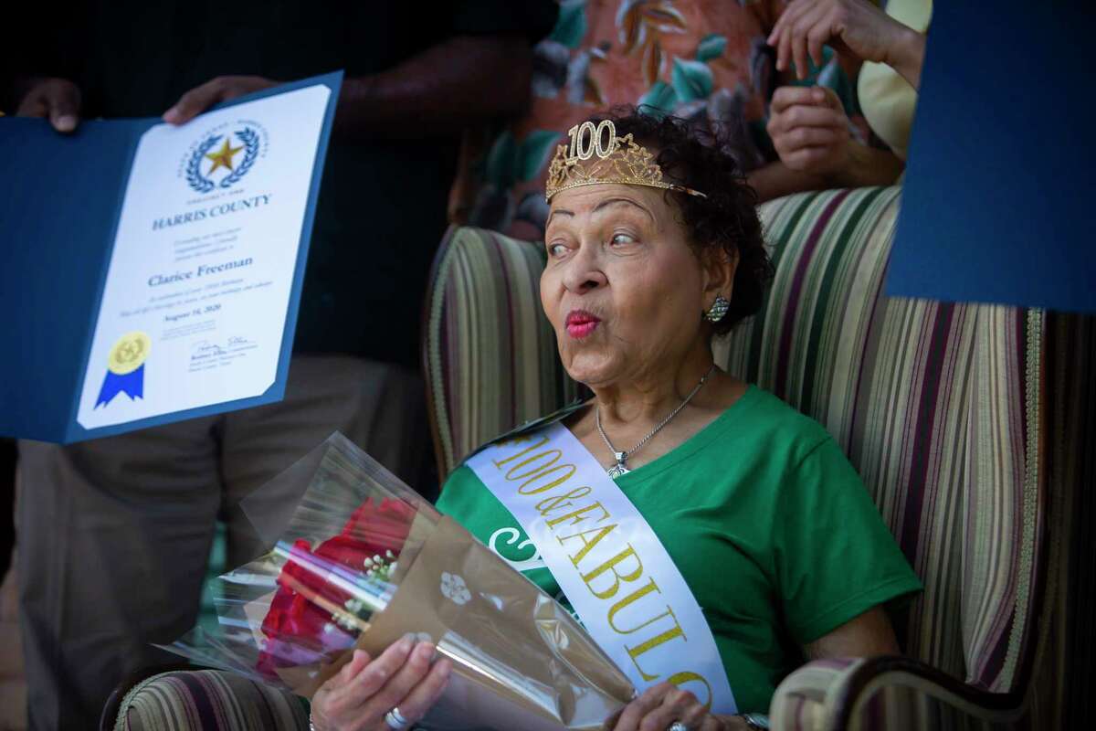 Clarice Freeman reacts at the birthday attention during her 100th birthday celebration at her home in 2020. 