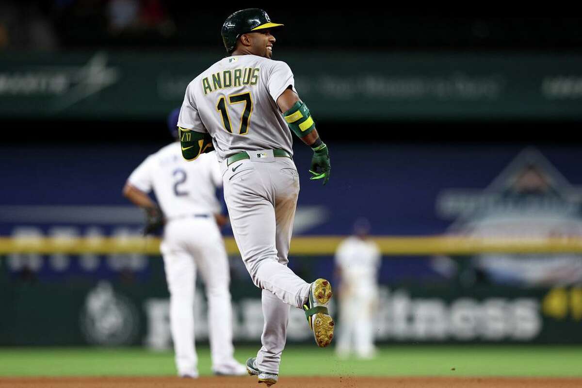 ARLINGTON, TEXAS - AUGUST 16: Elvis Andrus #17 of the Oakland Athletics celebrates after hitting a two-run home run against Taylor Hearn #52 of the Texas Rangers in the top of the seventh inning at Globe Life Field on August 16, 2022 in Arlington, Texas. (Photo by Tom Pennington/Getty Images)