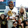 Brandon Crawford of the San Francisco Giants stands with his wife and kids after receiving his Rawling Gold Glove Award at Oracle Park on April 09, 2022 in San Francisco, California. 
