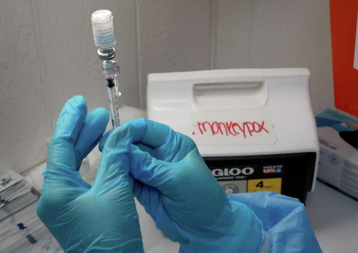 Miriala Gonzalez, a registered nurse, measures a monkeypox vaccination at a clinic in Miami, Fla., on Monday.