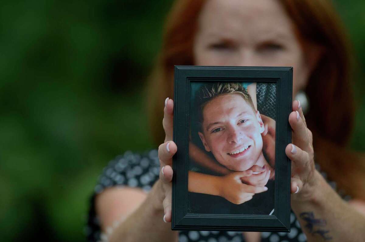 Fran O’Neill holds a photograph of her son, Neil Yandow, who died from a drug overdose in 2019.