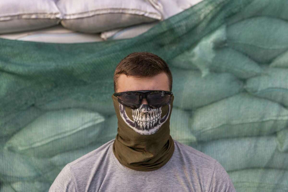 A member of the Ukrainian underground resistance, code-named Svarog, who was made available for an interview by the Ukrainian military, in southeastern Ukraine, Aug. 12, 2022. Clandestine resistance cells are spotting targets, sabotaging rail lines and killing those deemed collaborators as they seek to unnerve Russian forces. (David Guttenfelder/The New York Times)