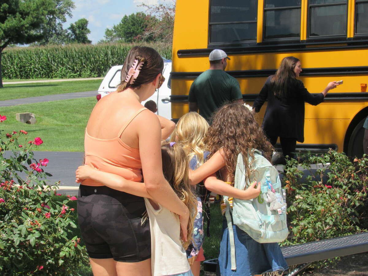 It was all hugs and smiles at parent pick-up at Hamel Elementary School after the first day of school on Wednesday. 