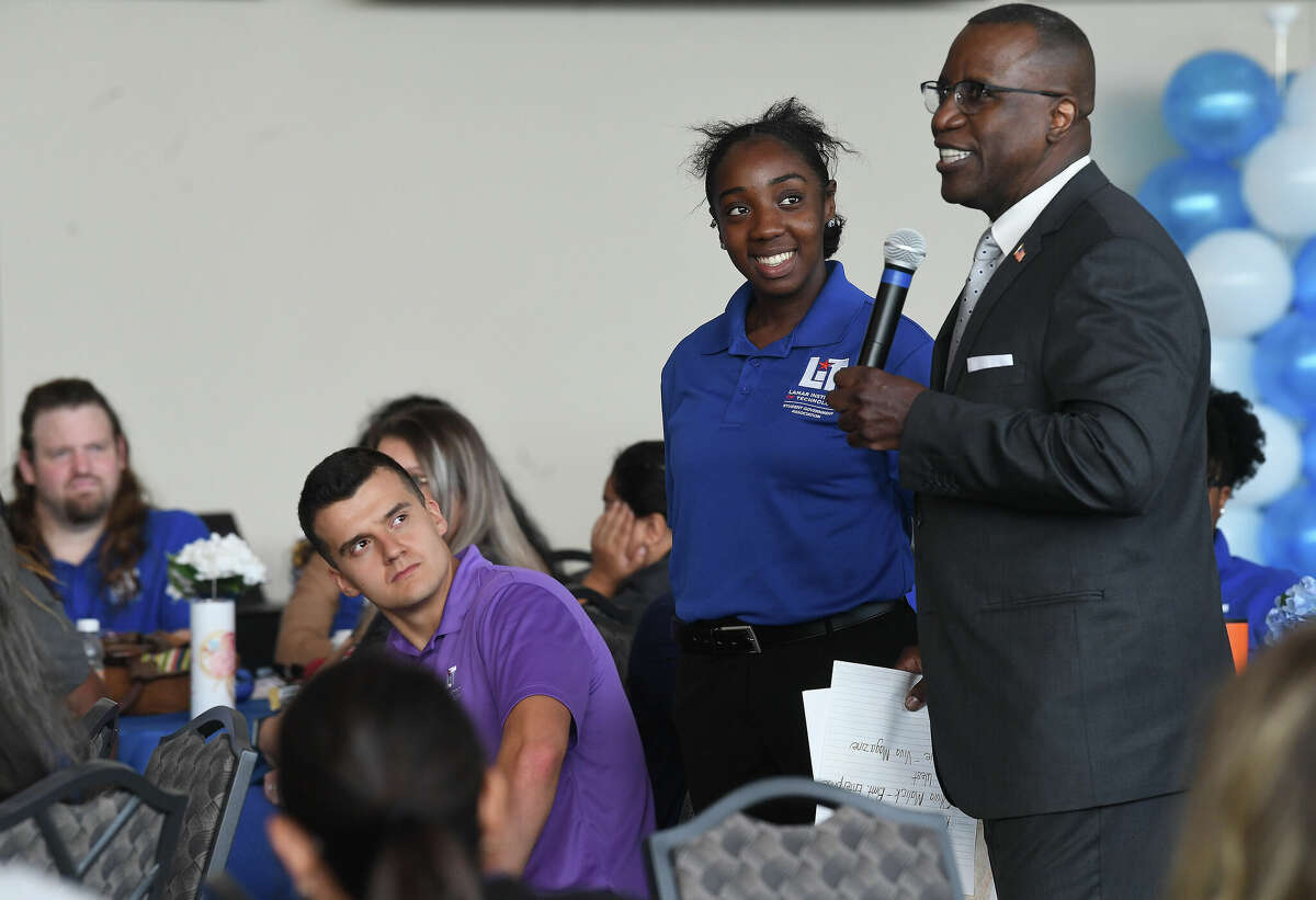 Outgoing president Lonnie Howard talks with new transfer student Asia Ashon as he talks about the many accomplishments achieved during Lamar Institute of Technology's convocation at the Event Centre Wednesday. Photo made Wednesday, August 17, 2022 Kim Brent/Beaumont Enterprise