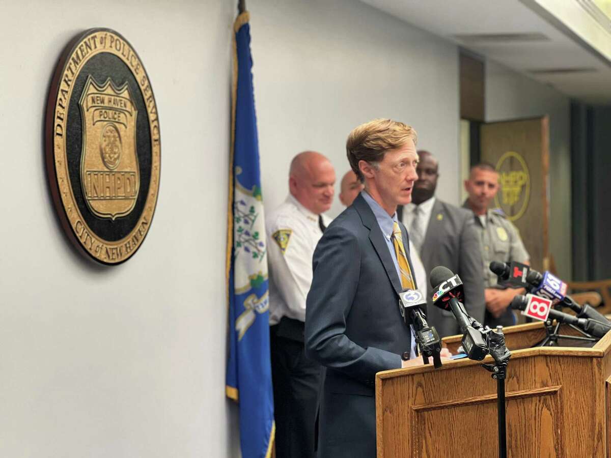 New Haven officials provided an update on violence and policing efforts in the city Wednesday. Here, Mayor Justin Elicker speaks.