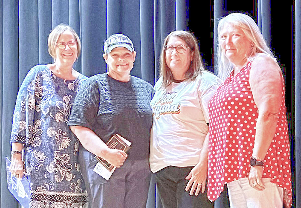 Jennifer Bible (second from left) was on hand Monday to receive Jacksonville School District 117's Bill Russell Award for excellence in teaching. Also pictured are Tammy Joseph (from left), Jennifer Nebel and Rhonda Johnson.