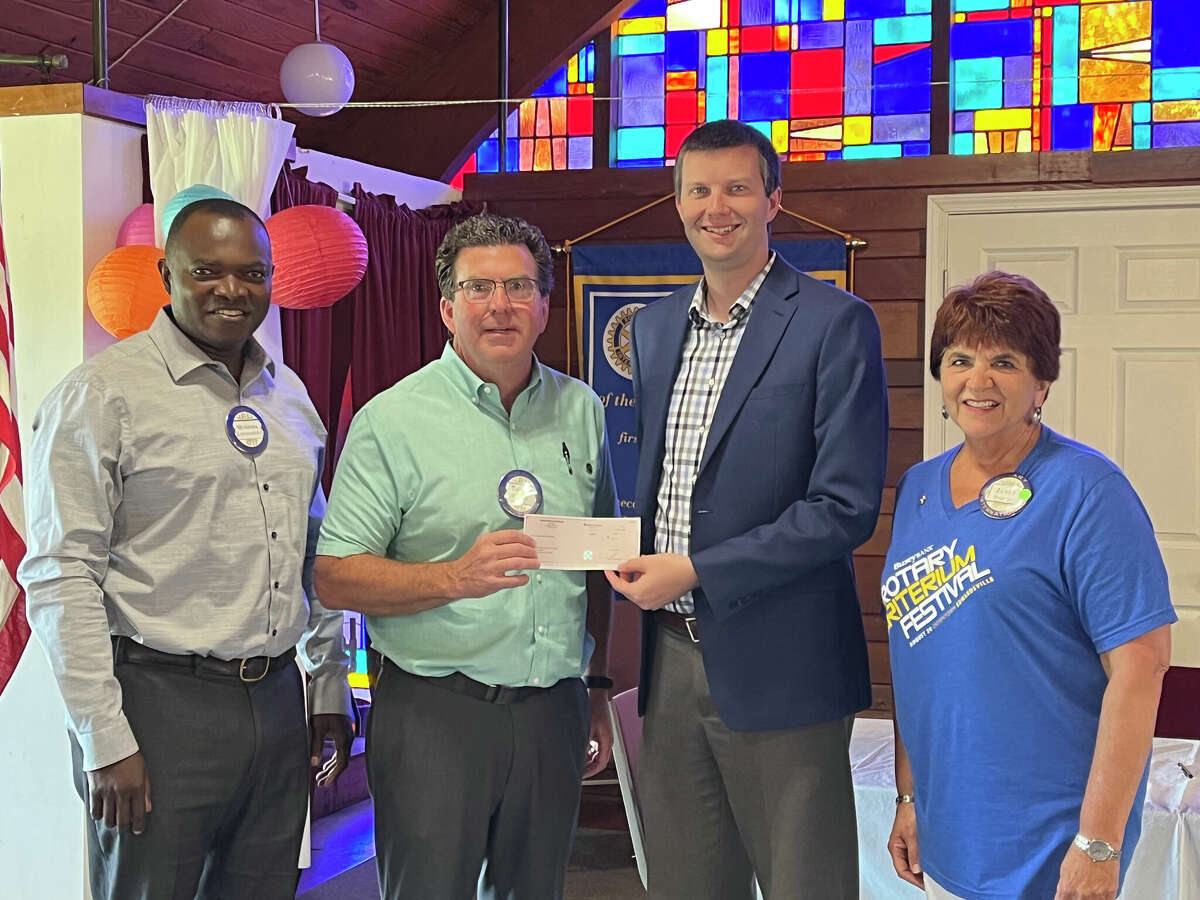 Pictured from left to right, Musonda Kapatamoyo, Rotary Club Vice President; Brian Mulhall, Race Director and Rotarian; Kevin Hall Edwardsville Township Supervisor; Janet Haroian Edwardsville Township Trustee and Edwardsville Rotary club member. 