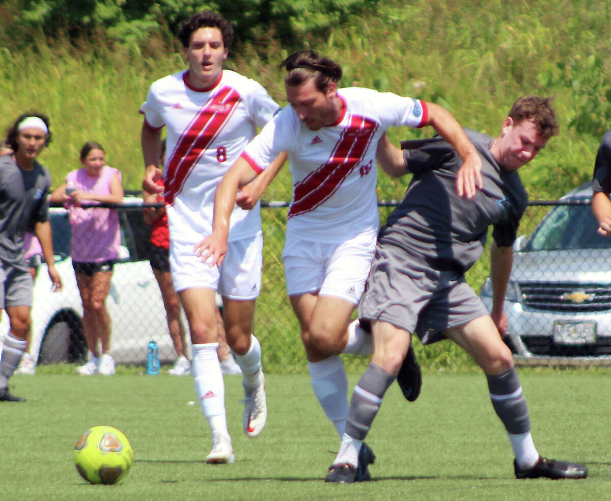 Ben Britton of Lewis and Clark Community College, far right, battles for the ball against UMSL in Wednesday's preseason game at the Lou Fusz Soccer Complex. LCCC won 2-1. The Trailblazers will open their regular season against Illinois Valley at 1 p.m. Sunday at Tim Rooney Stadium.