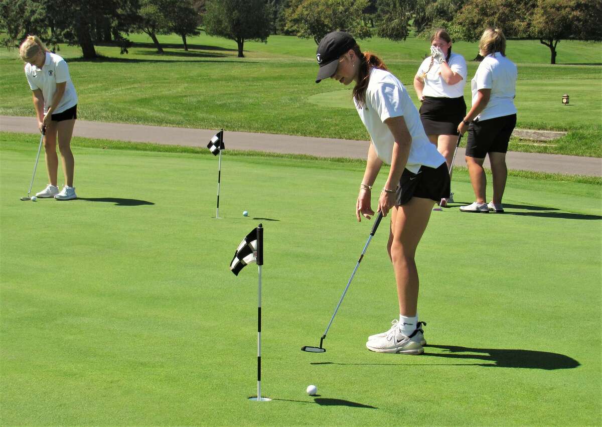 FILE - Manistee junior Kendal Waligorski's putt sails a bit to the left on the putting green at Manistee Golf and Country Club on Aug. 17.